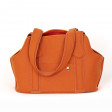 Sac Patapon en feutre de laine et gansé de cuir de couleur potiron.